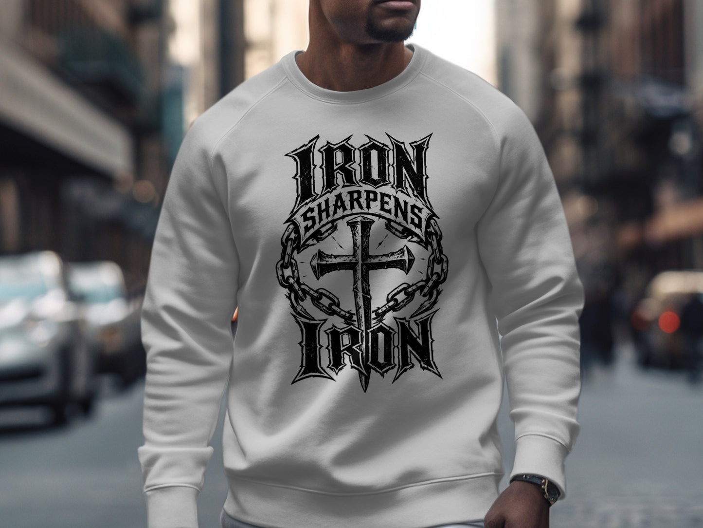 White sweatshirt with "IRON SHARPENS IRON" text and a cross design.