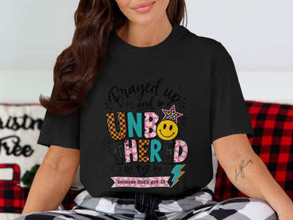 Black t-shirt with "Prayed up and UNBOTHERED because God's got it" graphic.