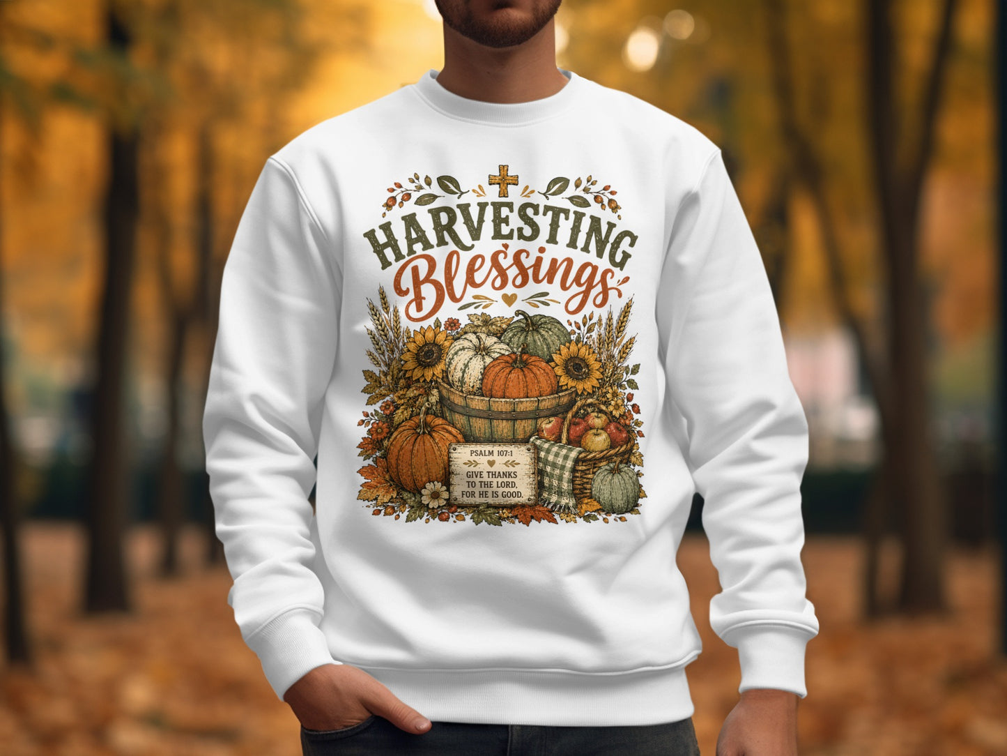 White sweatshirt with "Harvesting Blessings" and Psalm 107:1 text.