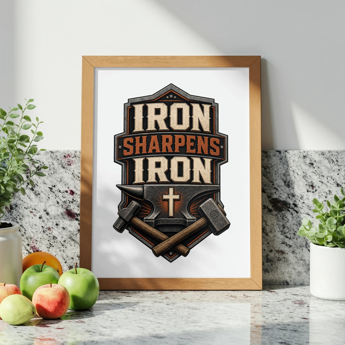 Framed print featuring an anvil, hammers, and the text "IRON SHARPENS IRON" with a cross.
