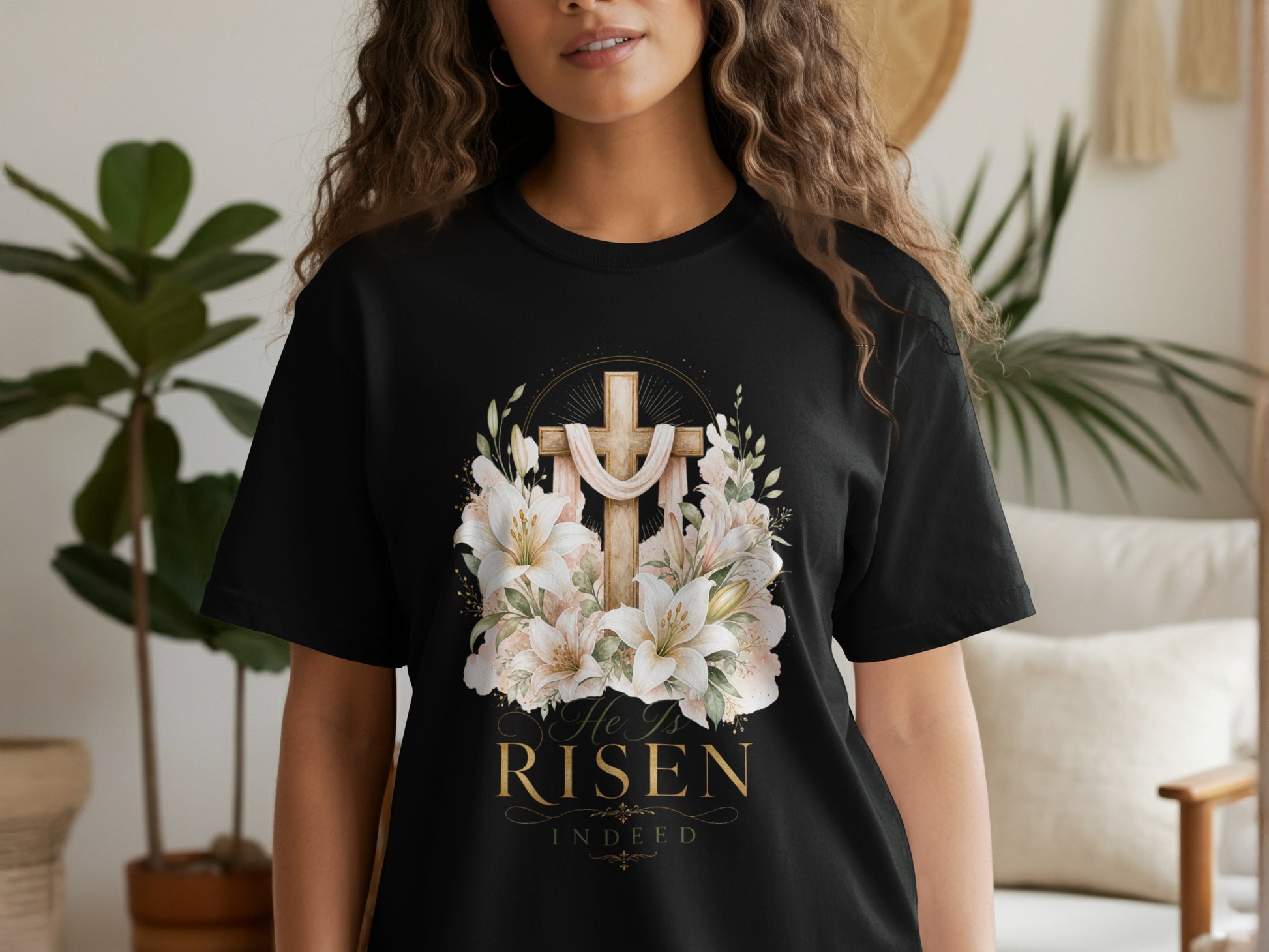 Black t-shirt with a cross, lilies, and text "He Is Risen Indeed".