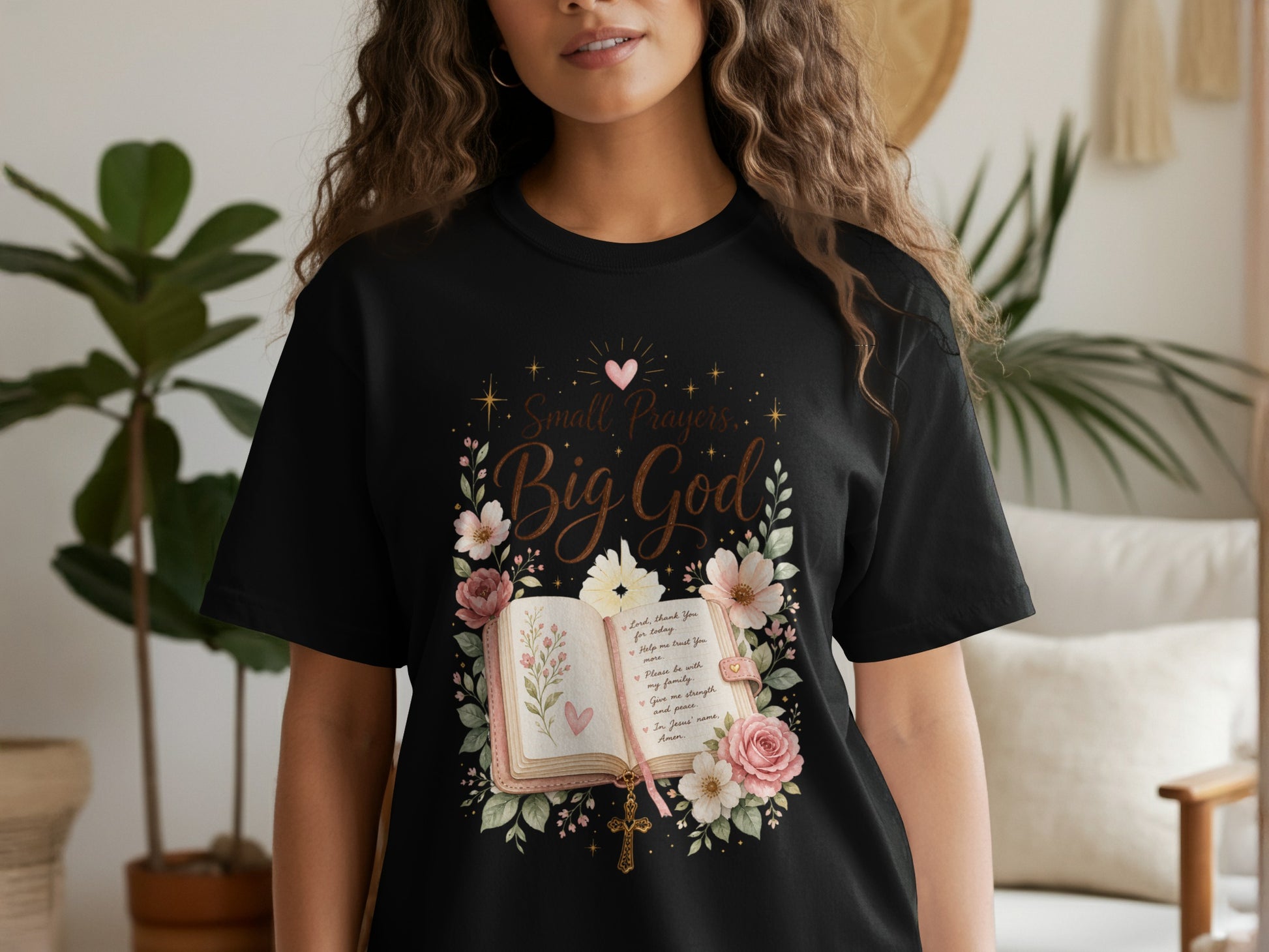 Black t-shirt with "Small Prayers, Big God" text, open book, and floral design.