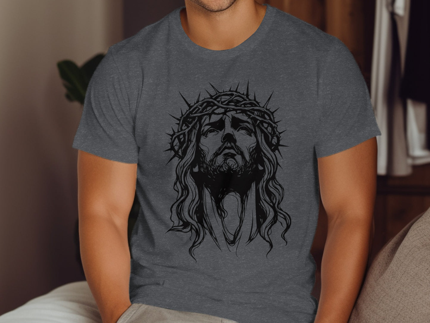 Jesus wearing a crown of thorns on a charcoal gray t-shirt.