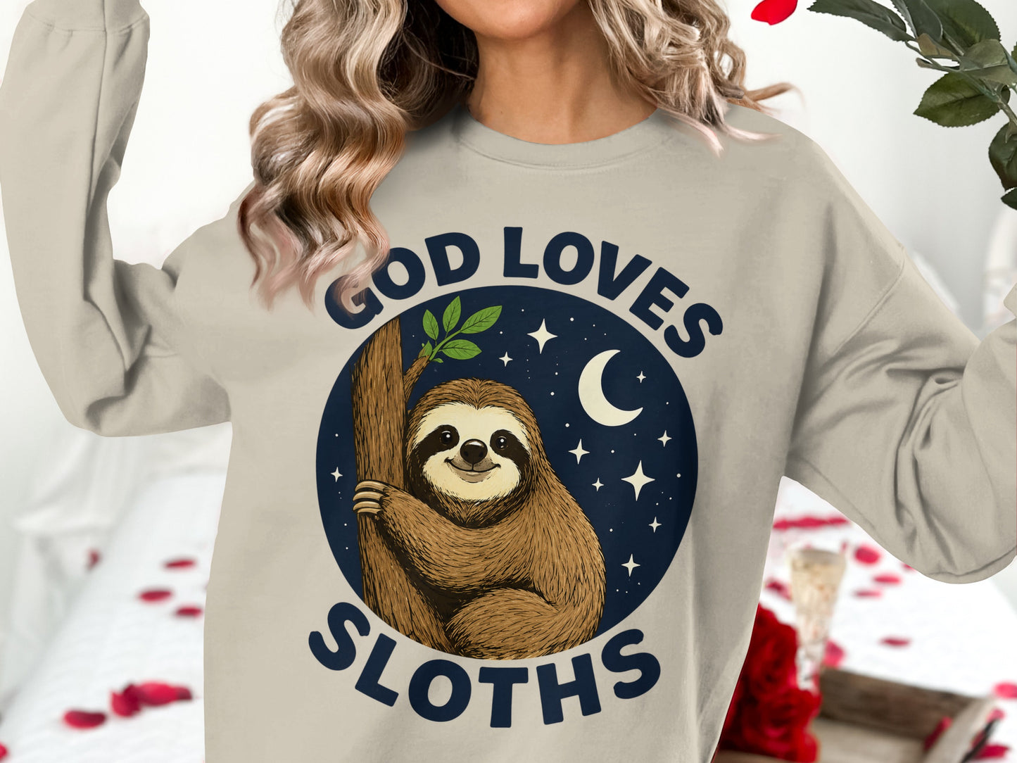 Sloth on tree with moon and stars, text "GOD LOVES SLOTHS".