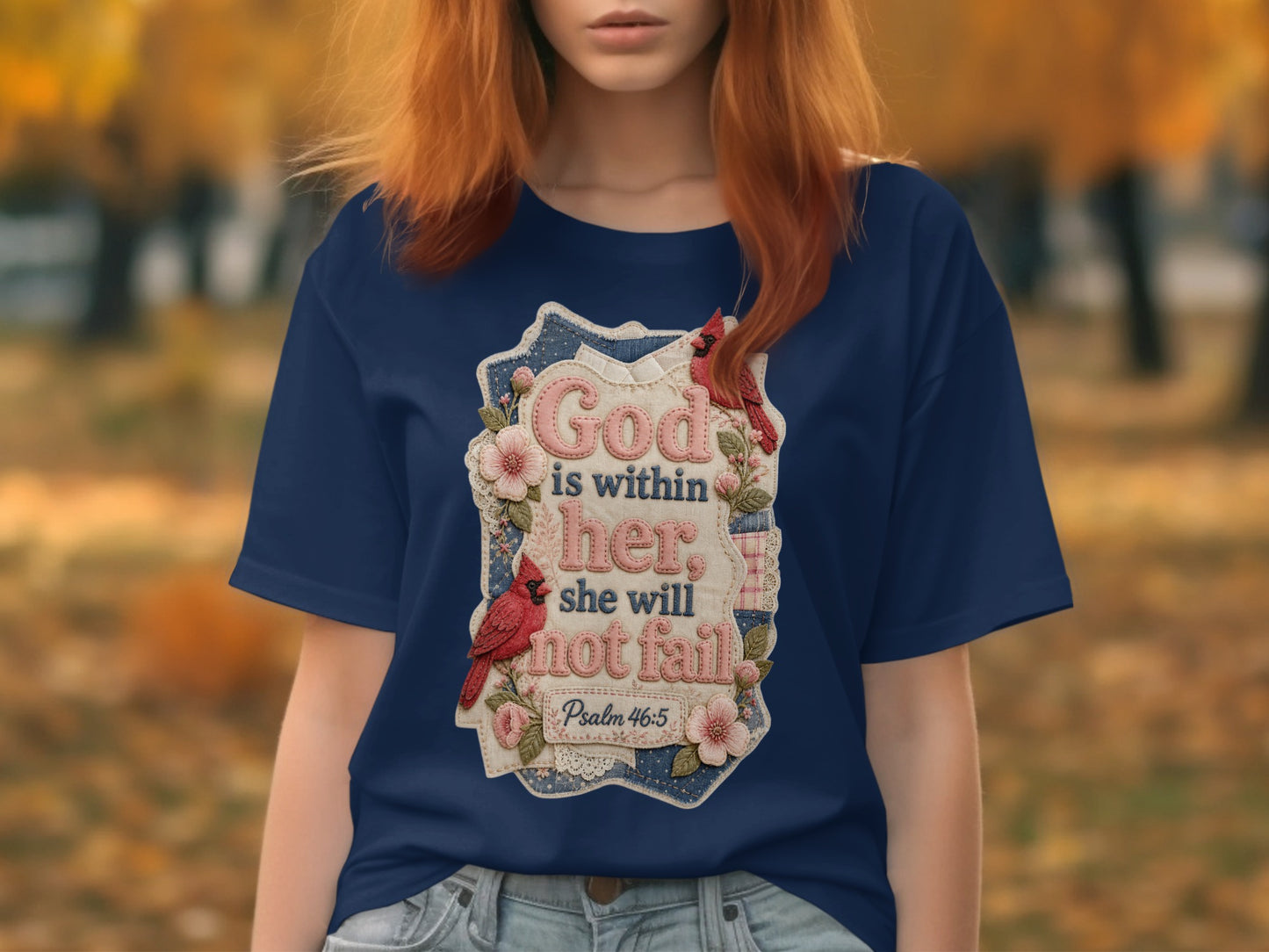 Navy blue t-shirt with embroidered graphic of cardinals, flowers, and scripture.