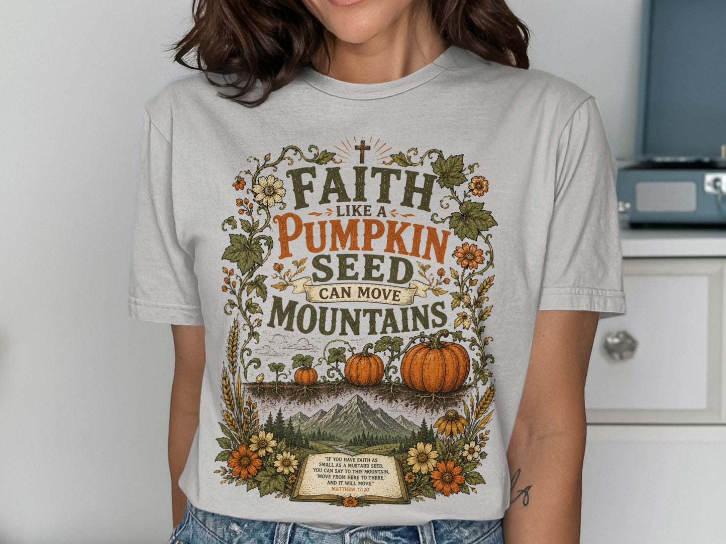Faith like a pumpkin seed can move mountains graphic tee with biblical verse.