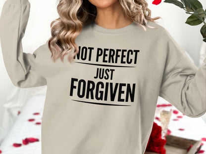 Lightweight crewneck sweatshirt with "NOT PERFECT JUST FORGIVEN" text.