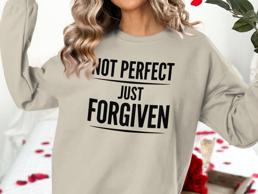 Lightweight crewneck sweatshirt with "NOT PERFECT JUST FORGIVEN" text.