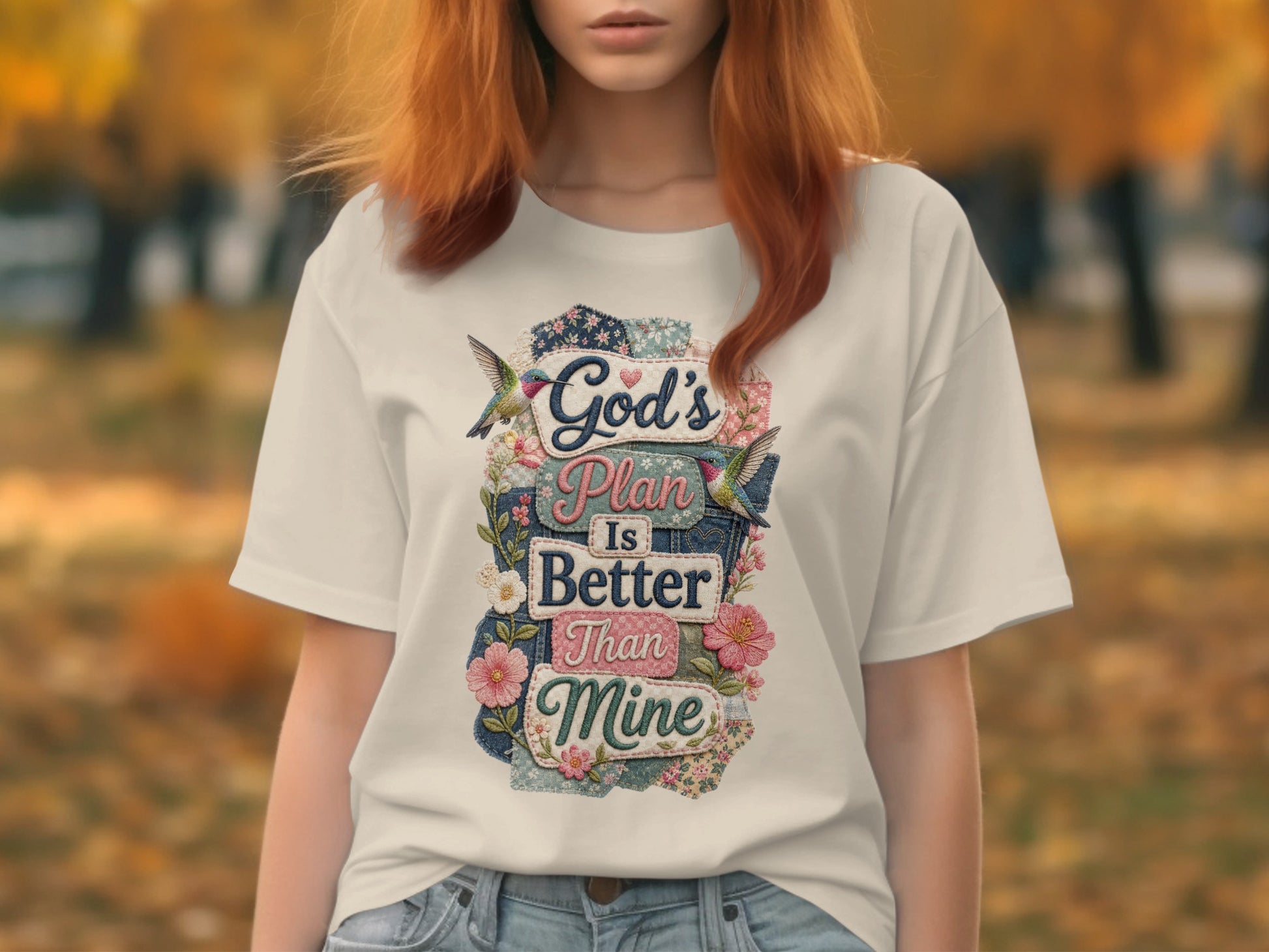 White t-shirt with "God's Plan Is Better Than Mine" floral and denim patch text.