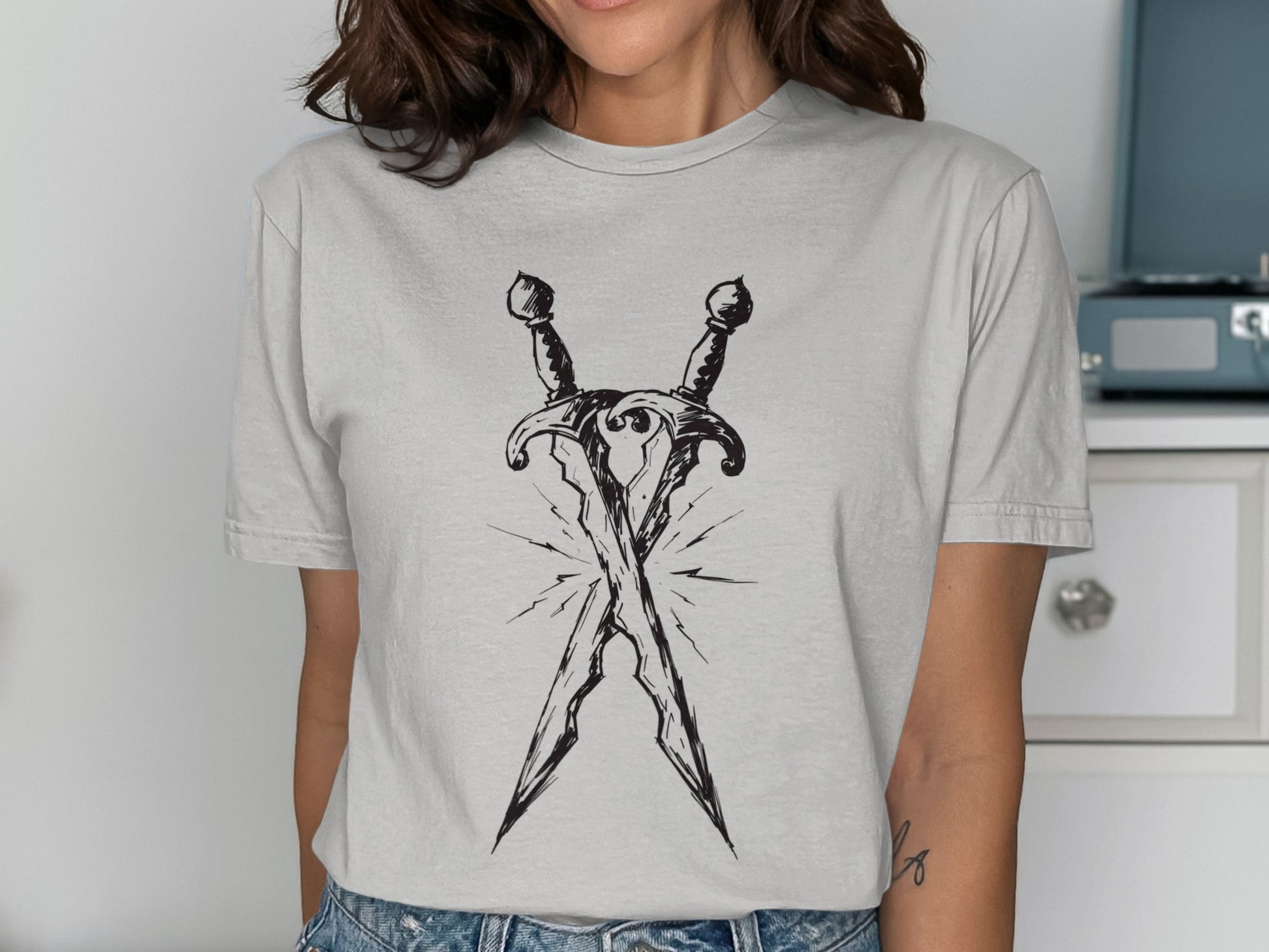 Light grey t-shirt with crossed swords graphic.