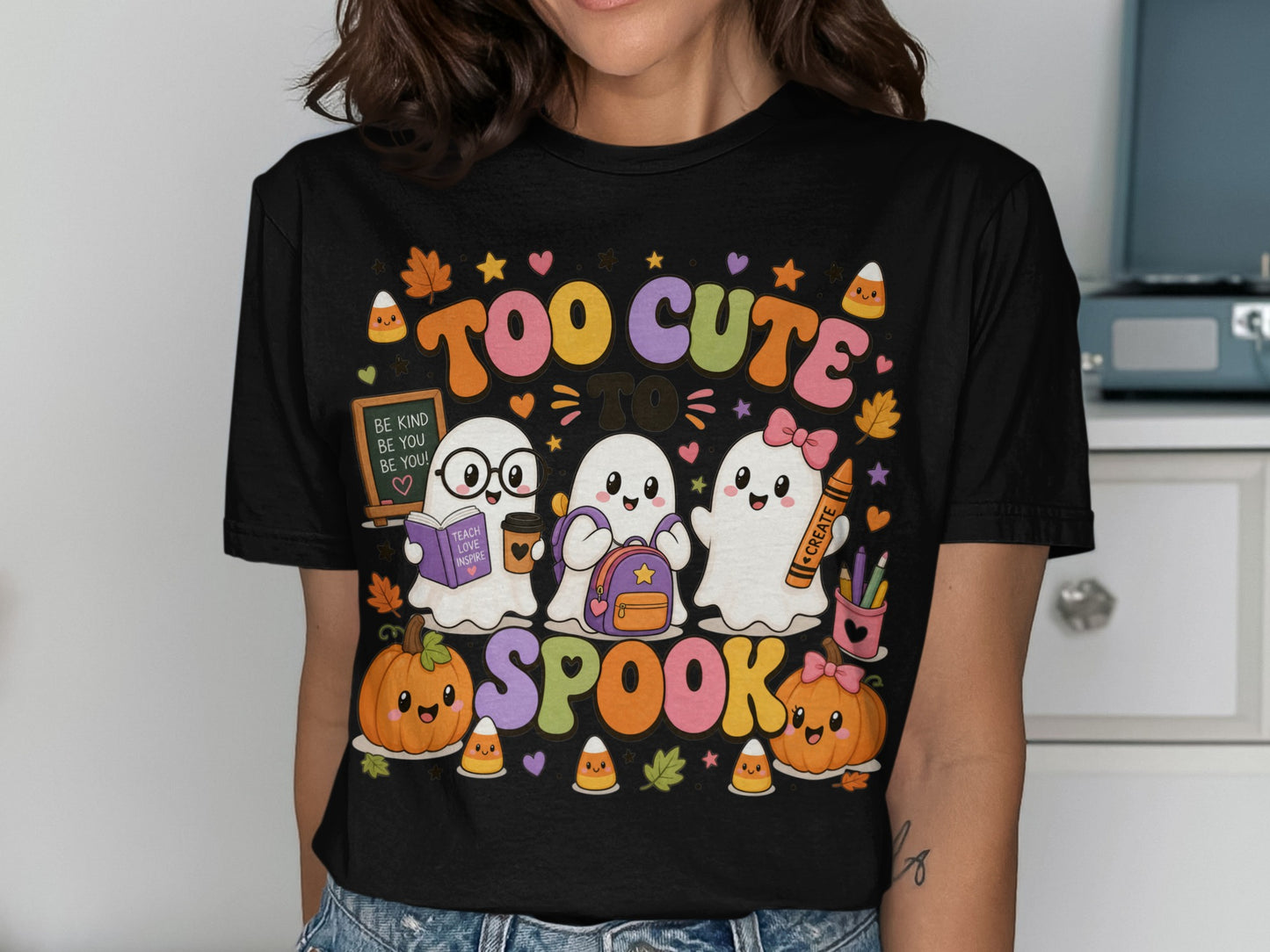 Three cute ghosts, pumpkins, and candy corn with text "Too cute to spook."