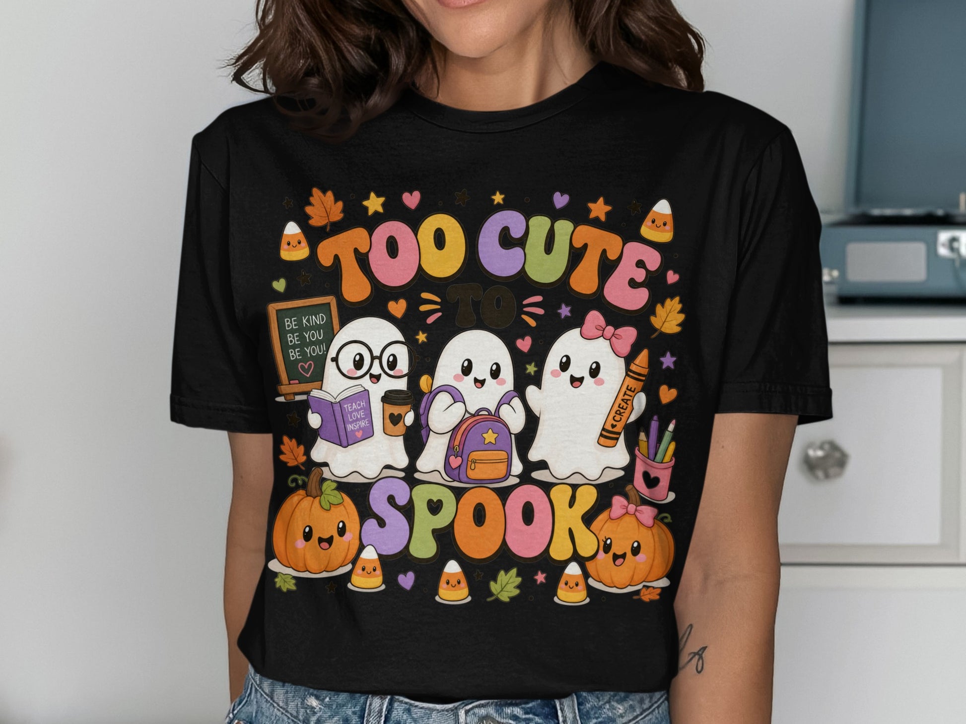 Three cute ghosts, pumpkins, and candy corn with text "Too cute to spook."