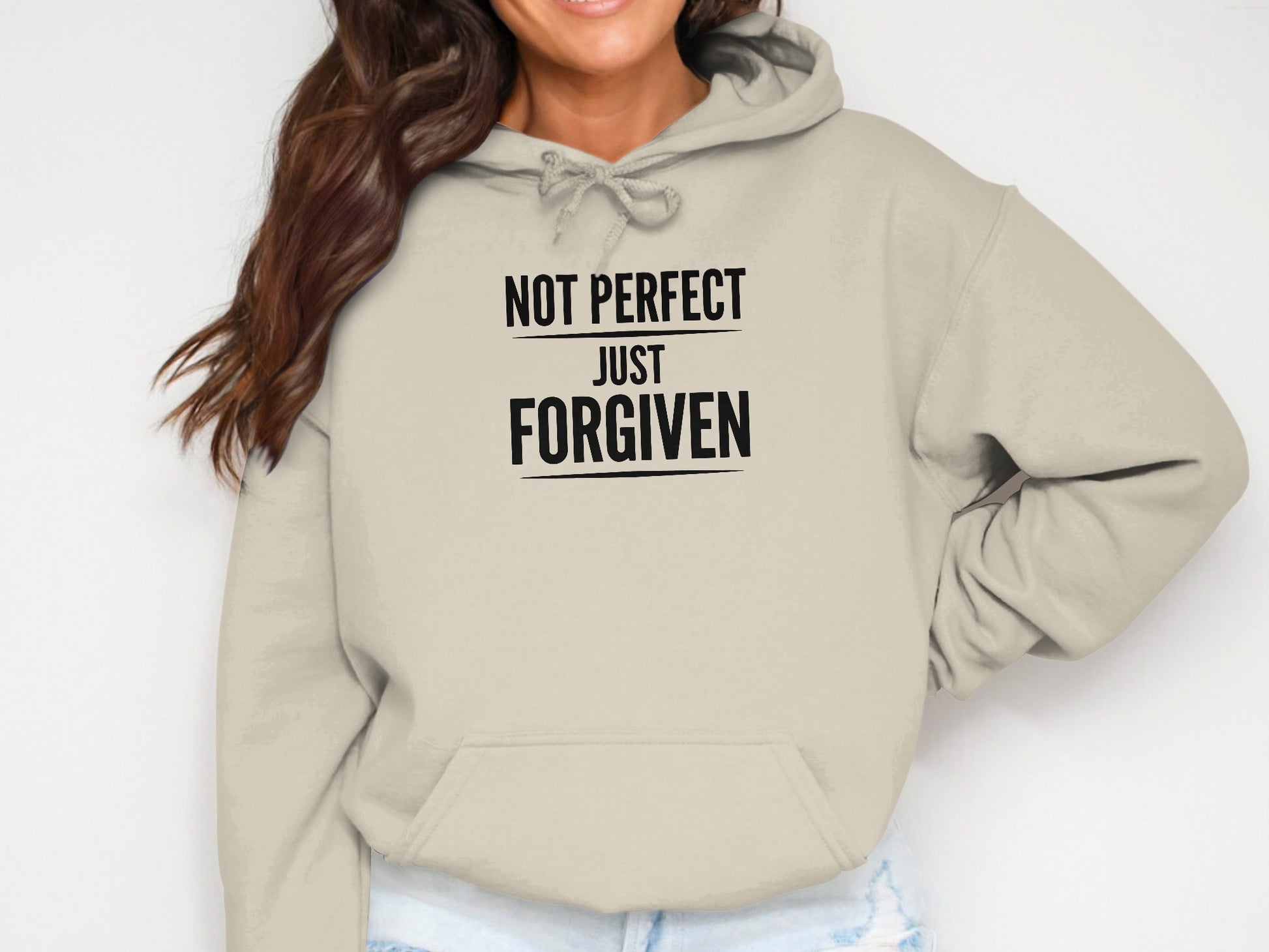 Cream hoodie with black text "NOT PERFECT JUST FORGIVEN".