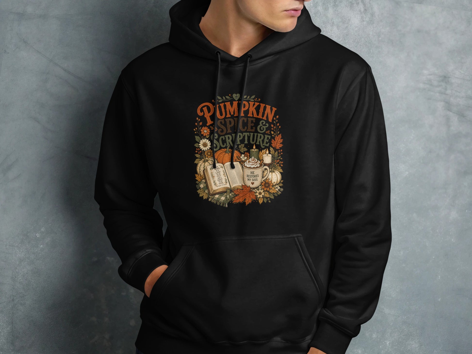 Black hoodie with "Pumpkin Spice & Scripture" text and fall illustrations.