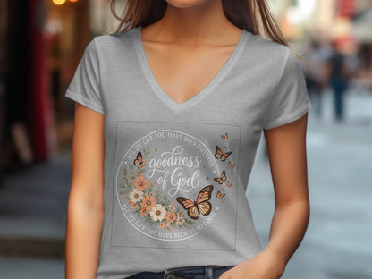 Gray v-neck t-shirt with floral circle and butterflies, "goodness of God" text.
