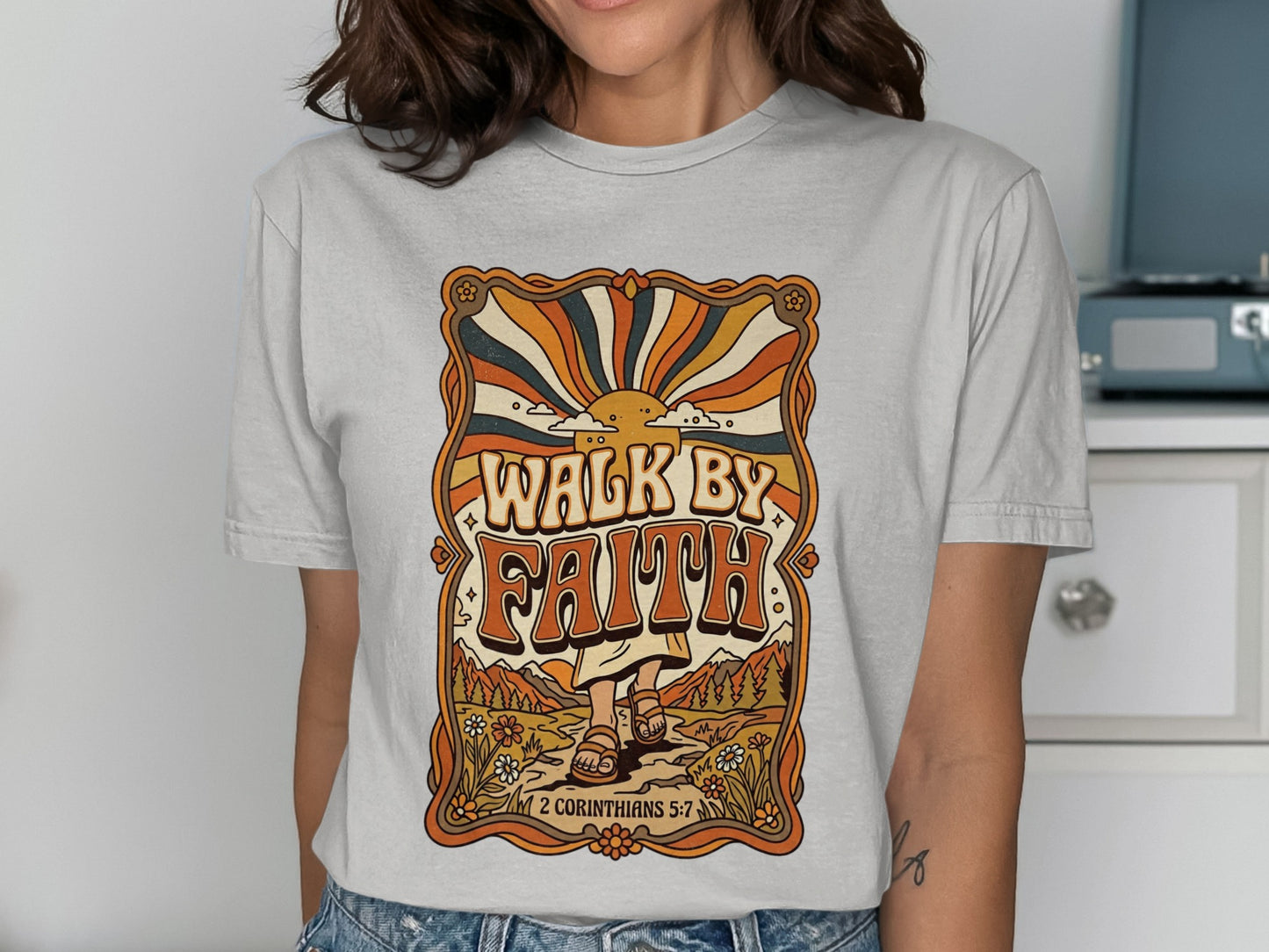 "Walk by Faith" graphic tee with retro sun and floral design, featuring scripture.