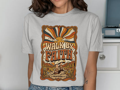 "Walk by Faith" graphic tee with retro sun and floral design, featuring scripture.