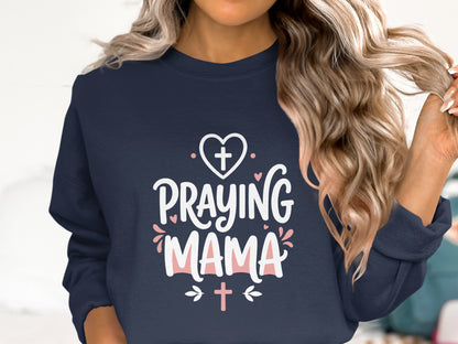 Navy sweatshirt with "Praying Mama" text and heart graphics.
