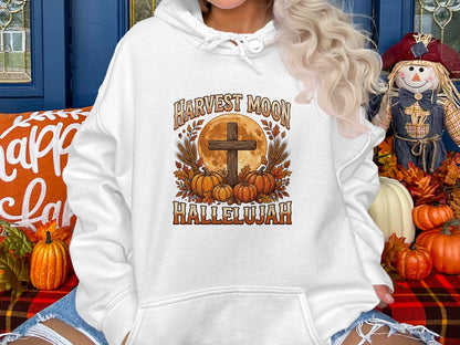 White hoodie with Harvest Moon Hallelujah text and autumn harvest graphics.