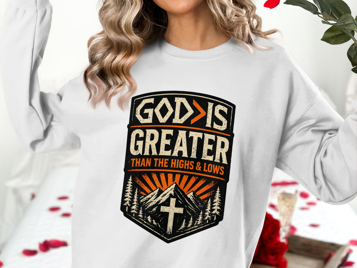 White sweatshirt with "God is greater than the highs and lows" text.