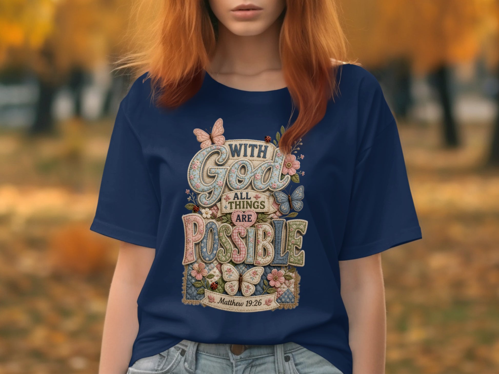 Navy t-shirt with "With God All Things Are Possible" text and floral design.