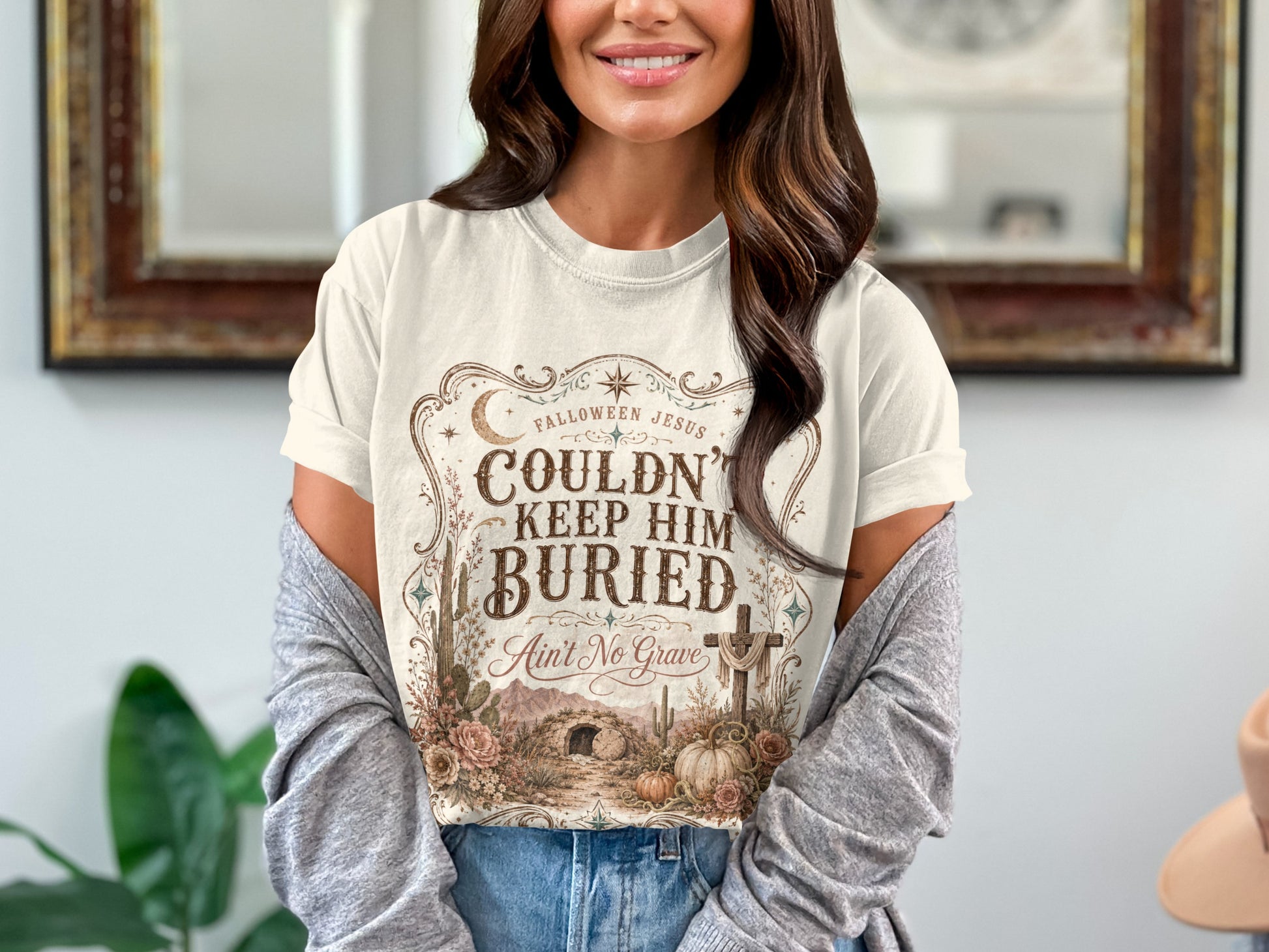 T-shirt with "Falloween Jesus Couldn't Keep Him Buried Ain't No Grave".