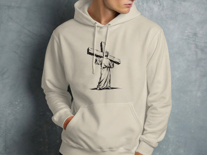 Jesus carrying a cross, graphic on a cream hoodie.