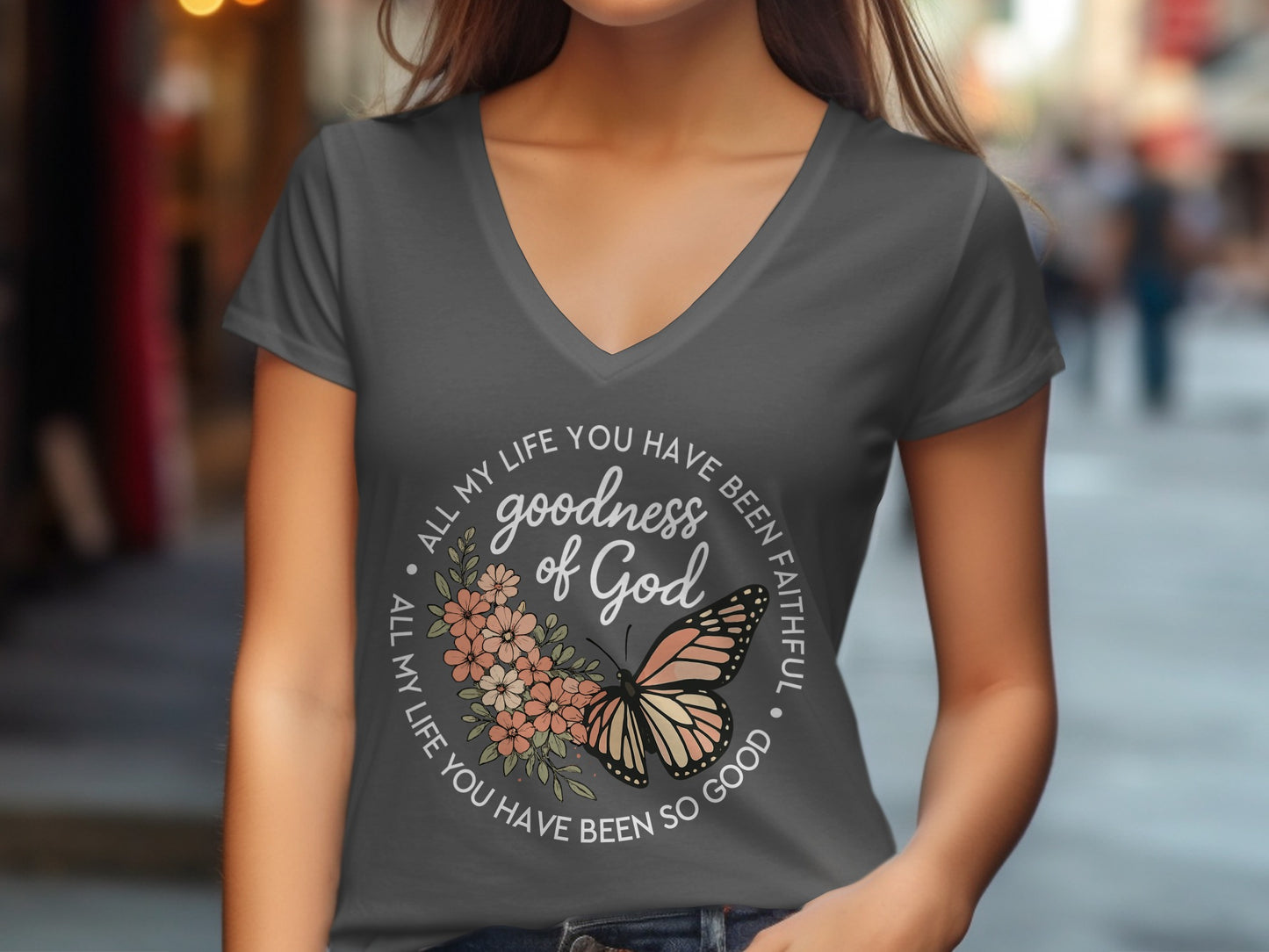 T-shirt with "goodness of God" and butterfly design.