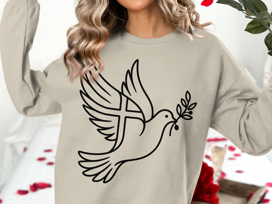 Beige sweatshirt with a black outline design of a dove holding an olive branch with a cross.