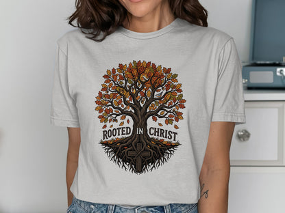 T-shirt graphic of a tree with roots and text "Rooted in Christ."
