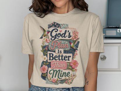 T-shirt with "God's Plan Is Better Than Mine" text and floral bird design.