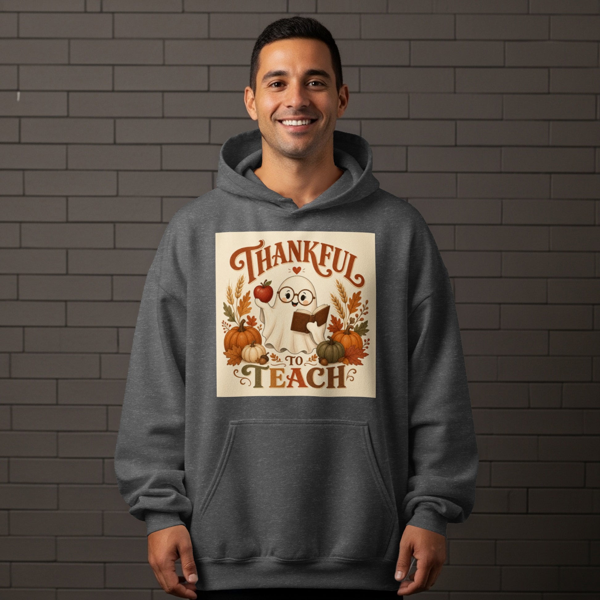 Ghost wearing glasses holding an apple and book, text "Thankful to Teach".