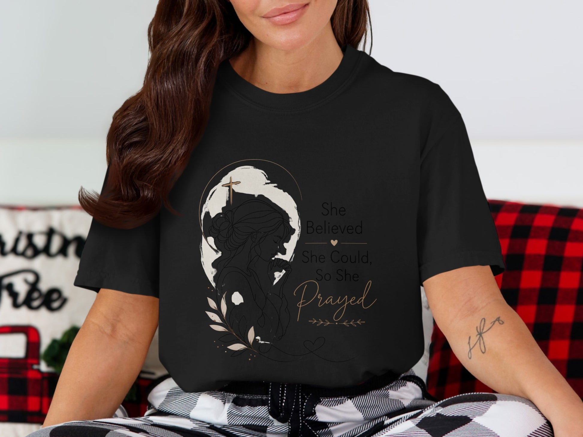 Black t-shirt with graphic: woman praying with cross, text "She Believed She Could, So She Prayed".