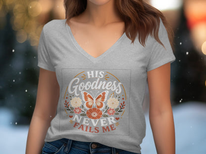 Grey v-neck t-shirt with "His Goodness Never Fails Me" text and butterfly design.