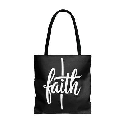 Black tote bag with white cursive "faith" text and a cross.