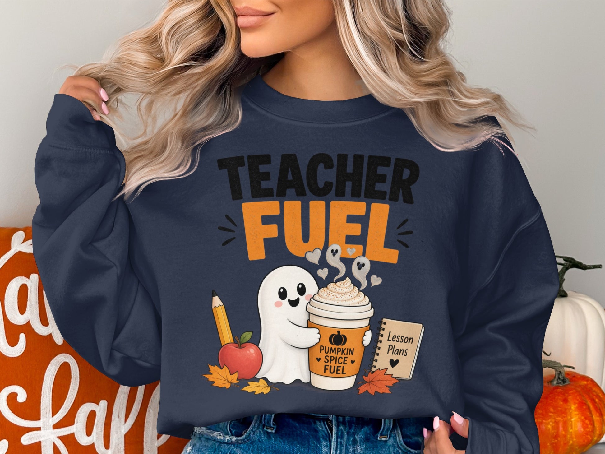 Navy sweatshirt with "Teacher Fuel" graphic featuring a ghost holding a pumpkin spice latte.
