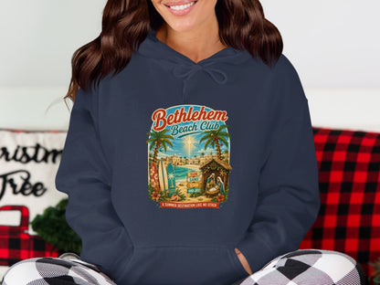 Bethlehem Beach Club graphic with nativity scene on a navy hoodie.