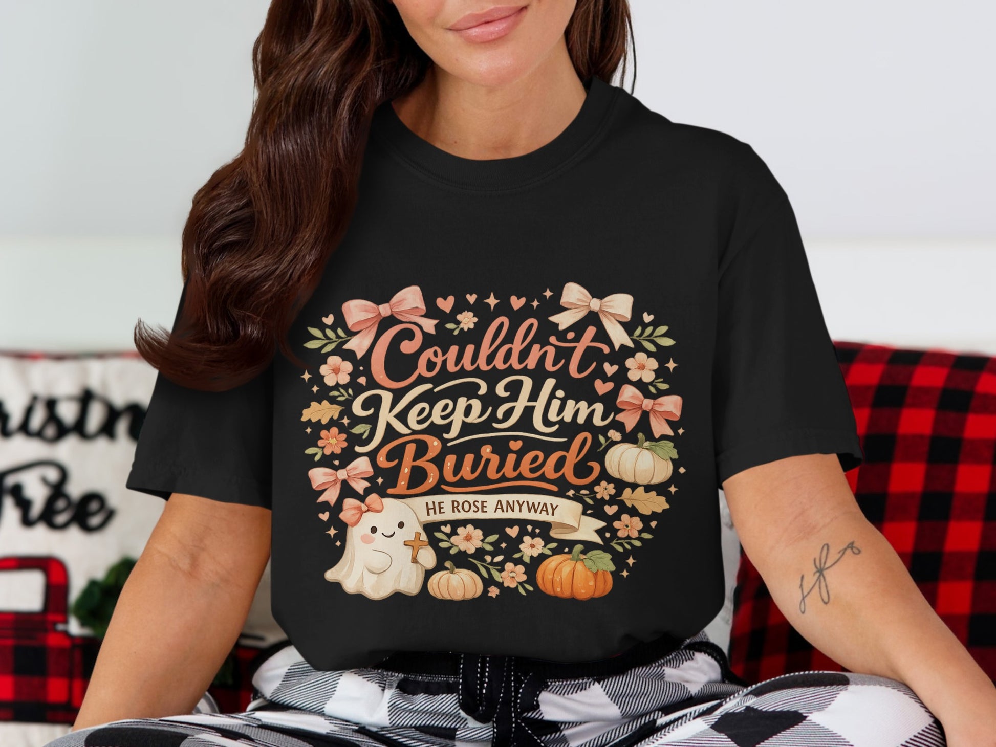 Black t-shirt with "Couldn't Keep Him Buried" and ghost graphic.
