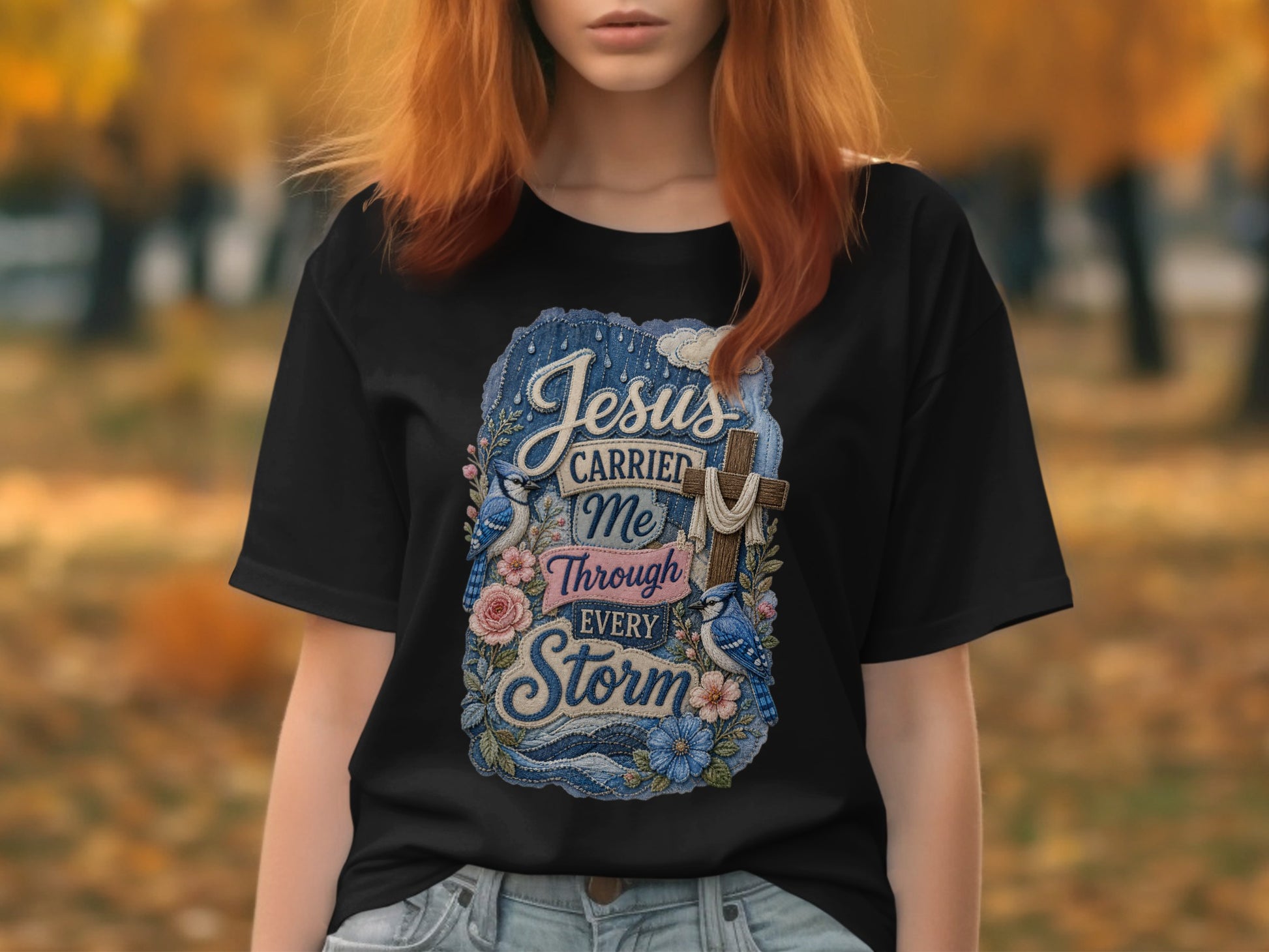 Black t-shirt with Jesus carried me through every storm graphic.