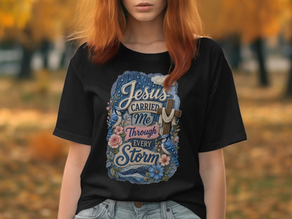 Black t-shirt with Jesus carried me through every storm graphic.