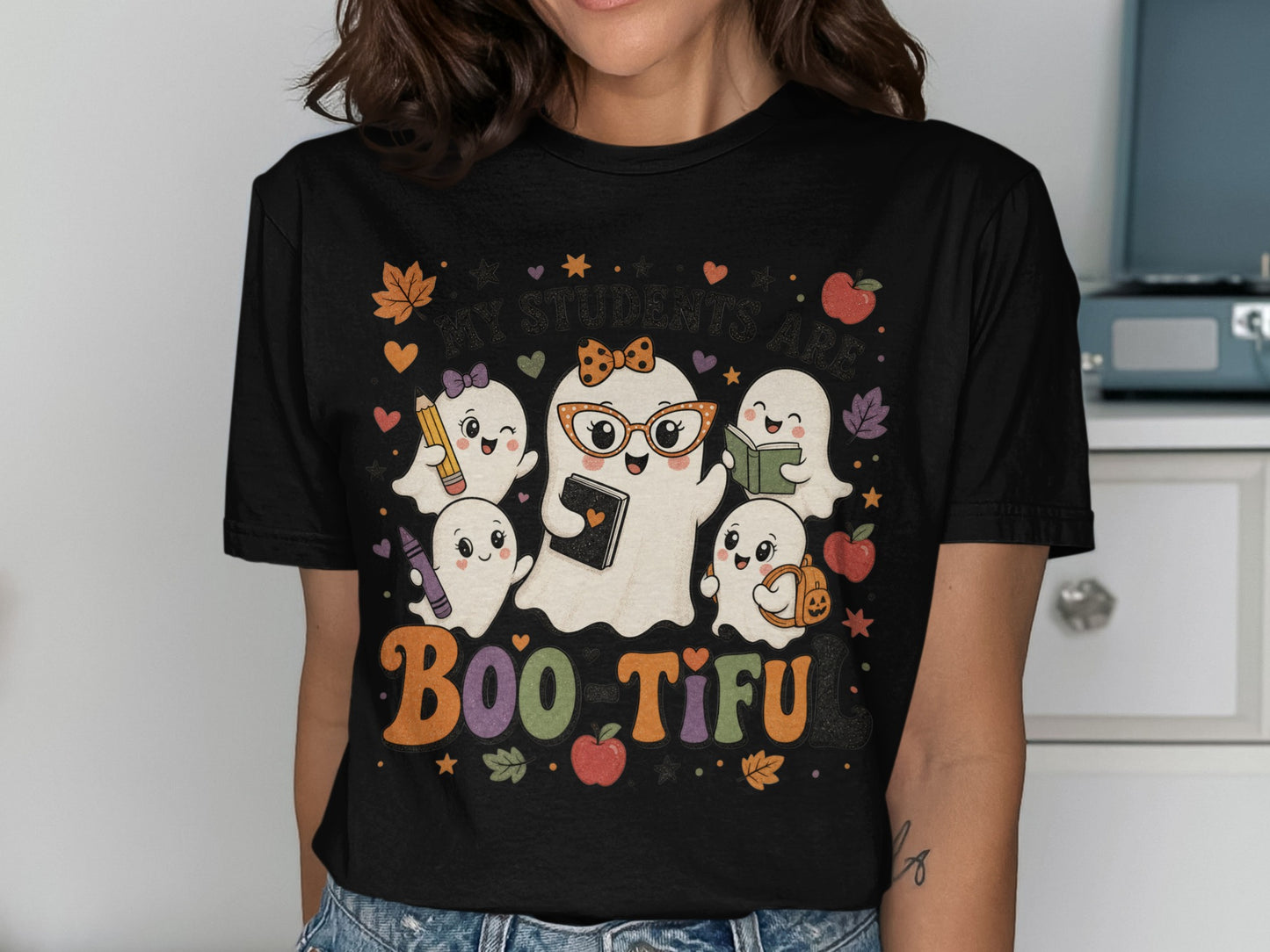 Cute ghosts with school supplies and text reading "My Students Are Boo-Tiful".