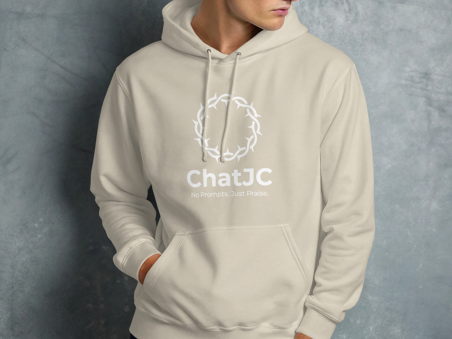 Beige hoodie with white crown of thorns and "ChatJC" logo.