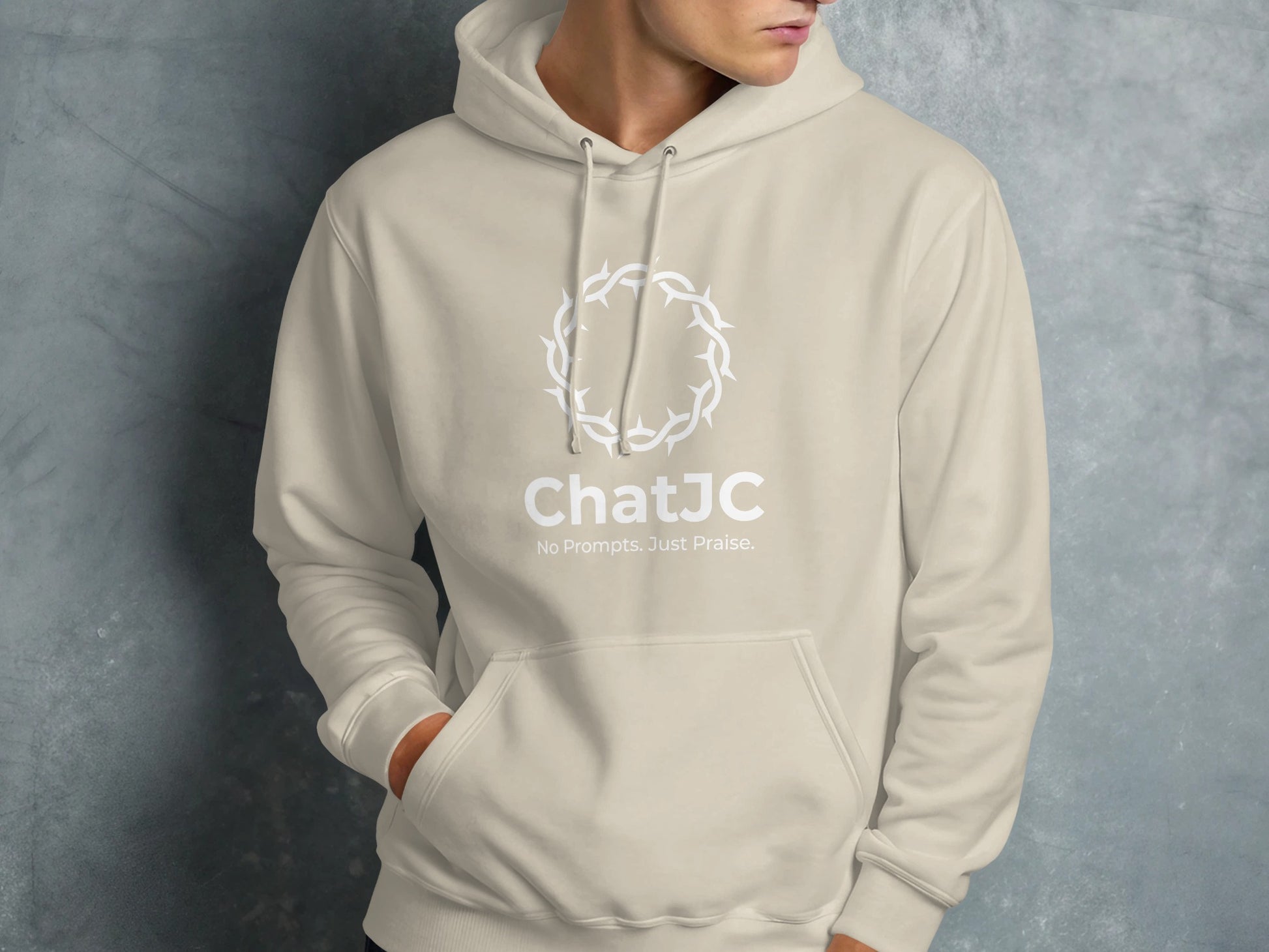 Beige hoodie with white crown of thorns and "ChatJC" logo.