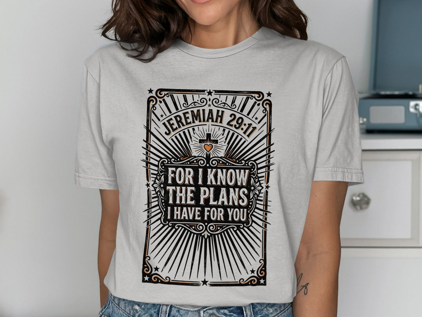 Jeremiah 29:11 "For I know the plans I have for you" graphic on a light grey t-shirt.