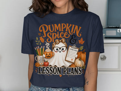 "Pumpkin Spice & Lesson Plans" text on a navy t-shirt with a ghost holding lesson plans.