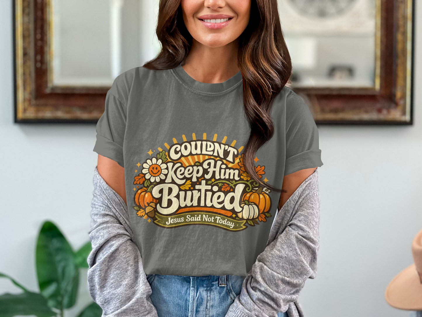 Grey t-shirt with "Couldn't Keep Him Buried Jesus Said Not Today" text and pumpkins.