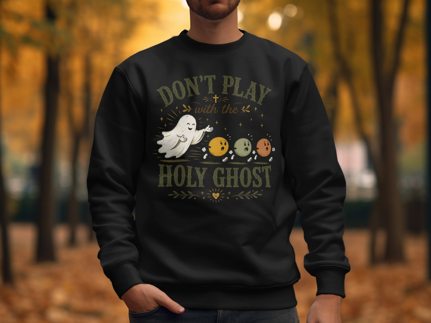 Black sweatshirt with text "Don't play with the holy ghost" and ghost illustration.