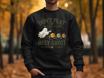 Black sweatshirt with text "Don't play with the holy ghost" and ghost illustration.
