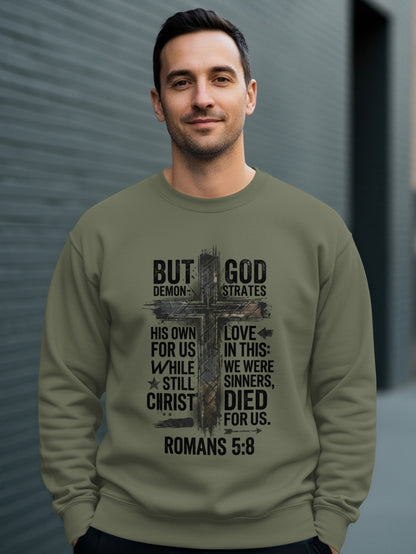Man wearing a graphic sweatshirt with religious text and a cross design.