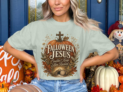 "Hallowen Jesus Couldn't Keep Him Buried" graphic on light green shirt.